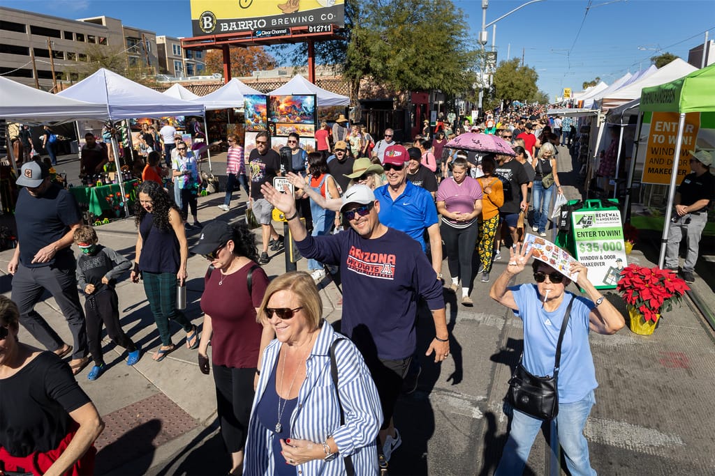 Crowd enjoying a lively outdoor street market