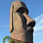 Moai statue with railing and red eye