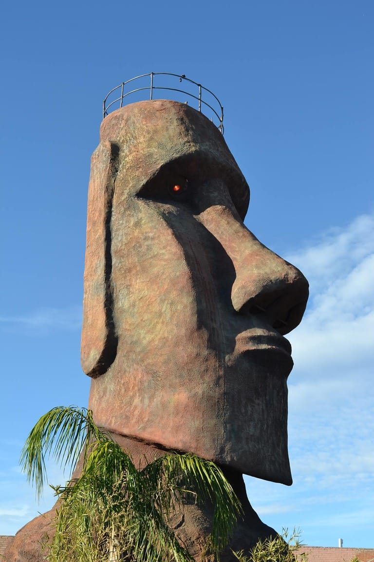 Moai statue with railing and red eye