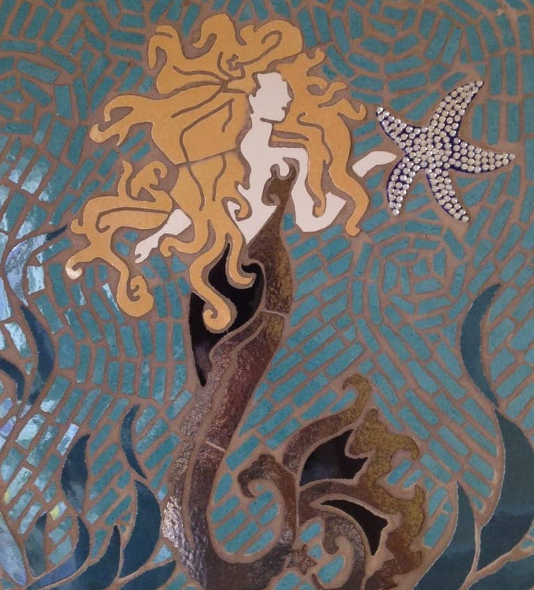 Mosaic of mermaid and starfish.