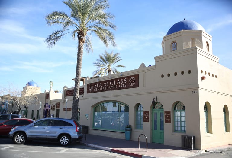 Art center with palm trees and blue dome
