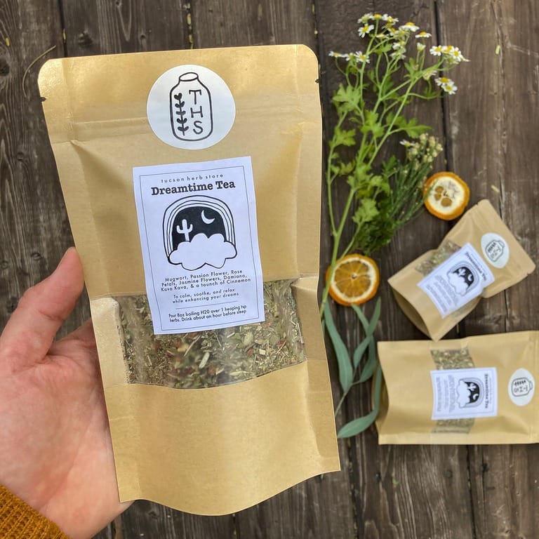 Hand holding Dreamtime Tea package