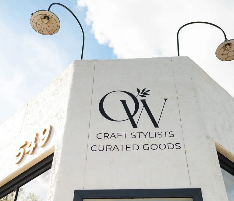 Storefront with logo and address