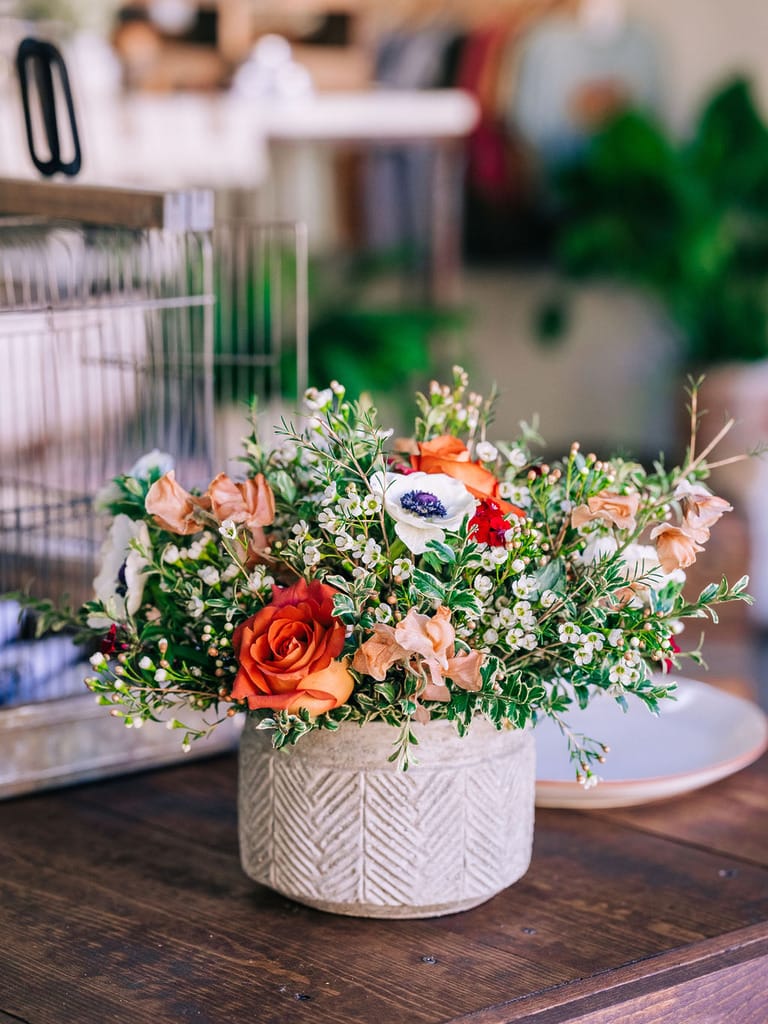 Colorful floral bouquet in textured vase