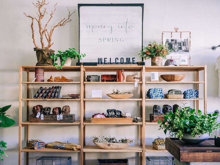Wooden shelves with spring decor and items.