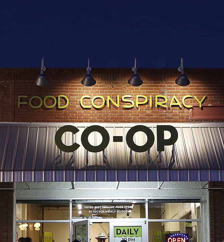 Food Conspiracy Co-op storefront at night