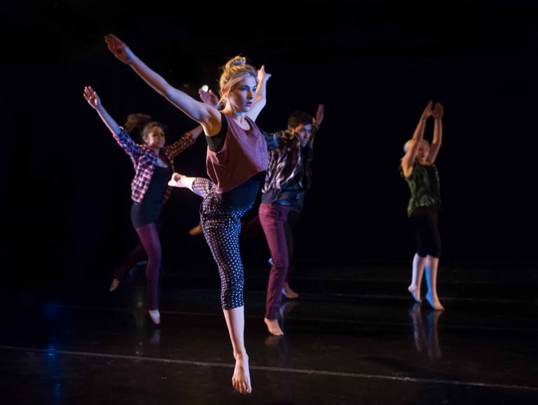 Group of dancers performing on stage